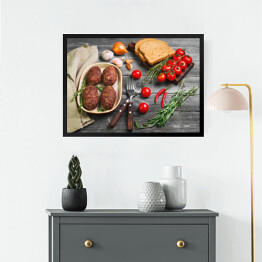 Obraz w ramie Kotlety mięsne na ceramicznym naczyniu