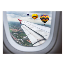Plakat samoprzylepny Widok za okno samolotu - balony unoszące się nad chmurami