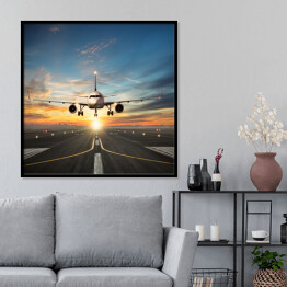 Plakat w ramie Samolot lądujący na pasie na tle pięknego nieba