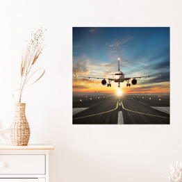 Plakat samoprzylepny Samolot lądujący na pasie na tle pięknego nieba