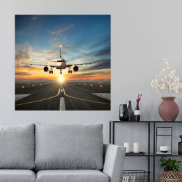 Plakat samoprzylepny Samolot lądujący na pasie na tle pięknego nieba