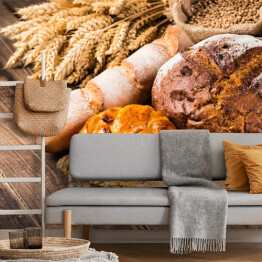 Fototapeta Kłosy zbóż oraz chleb na drewnianym stole