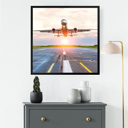 Obraz w ramie Samolot startujący z lotniska o świcie