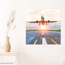 Plakat samoprzylepny Samolot startujący z lotniska o świcie