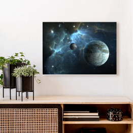 Obraz na płótnie Kamienna planeta oraz księżyc na tle mgławicy