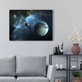Obraz na płótnie Kamienna planeta oraz księżyc na tle mgławicy