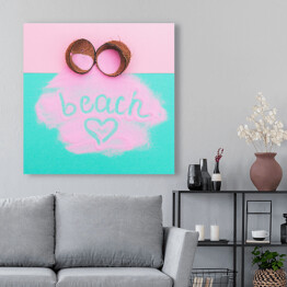 Obraz na płótnie Rozbity kokos z różową farbą i napisem "beach"