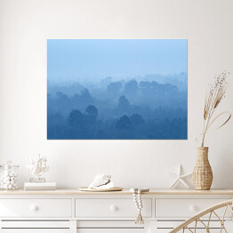 Plakat samoprzylepny Tropikalny las deszczowy we mgle w odcieniach koloru niebieskiego