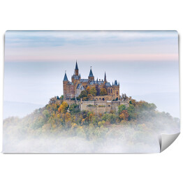 Fototapeta samoprzylepna Niemiecki zamek Hohenzollern nad chmurami