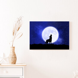 Obraz na płótnie Wyjący wilk na tle księżyca w ciemną noc