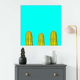Plakat samoprzylepny Kilka zielonych kaktusów na niebieskim tle