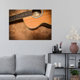 Plakat Gitara akustyczna na tle imiującym nieociosane drewno