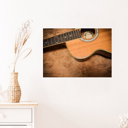 Plakat samoprzylepny Gitara akustyczna na tle imiującym nieociosane drewno