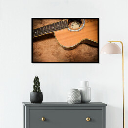 Plakat w ramie Gitara akustyczna na tle imiującym nieociosane drewno