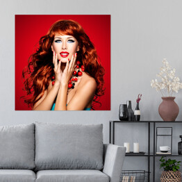 Plakat samoprzylepny Piękna zmysłowa kobieta z długimi czerwonymi włosami na czerwonym tle