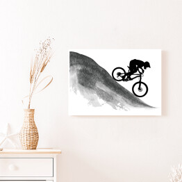 Obraz na płótnie Sylwetka rowerzysty zjeżdżającego z góry