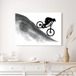 Obraz na płótnie Sylwetka rowerzysty zjeżdżającego z góry