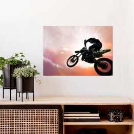 Plakat Motocykl w trakcie ekstremalnego skoku 