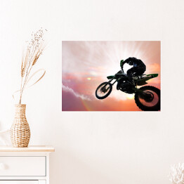 Plakat Motocykl w trakcie ekstremalnego skoku 