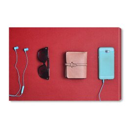 Obraz na płótnie Akcesoria dla kobiet na czerwonym tle - smartphone, słuchawki, portfel, okulary przeciwsłoneczne