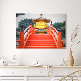 Obraz na płótnie Czerwony most prowadzący do azjatyckiego domu