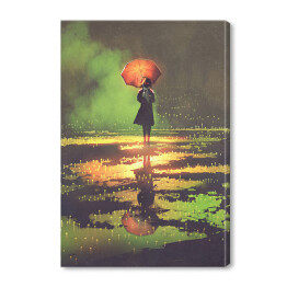 Kobieta pod parasolem w blasku zielonego światła