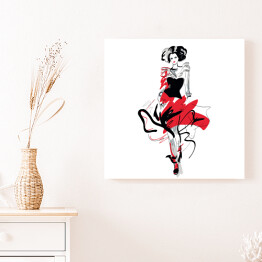 Obraz na płótnie Modelka w czerwono czarnej sukni na wybiegu