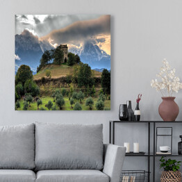Obraz na płótnie Zamek na wzgórzu na tle gór