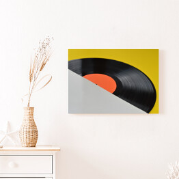 Obraz na płótnie Winylowa płyta z pustą pomarańczową etykietą na żółtym tle