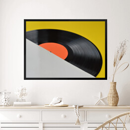 Obraz w ramie Winylowa płyta z pustą pomarańczową etykietą na żółtym tle