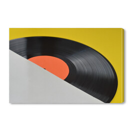 Obraz na płótnie Winylowa płyta z pustą pomarańczową etykietą na żółtym tle