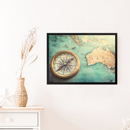 Obraz w ramie Stary kompas na kolorowej vintage mapie