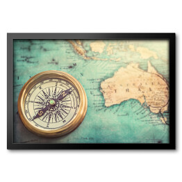 Obraz w ramie Stary kompas na kolorowej vintage mapie