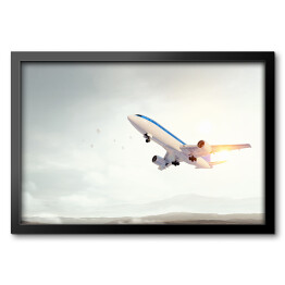 Obraz w ramie Samolot startujący o świcie