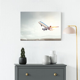 Obraz na płótnie Samolot startujący o świcie