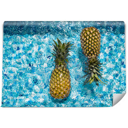 Fototapeta Dwa ananasy pływające w basenie