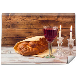 Fototapeta Szabat - kielich z winem i chlebem na drewnianym stole
