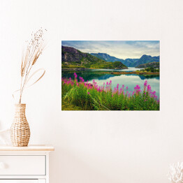 Plakat samoprzylepny Widok na norweski fiord, skaliste wybrzeże, pochmurne błękitne niebo i kwitnące różowe kwiaty