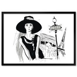 Plakat w ramie Młoda dziewczyna na tle Paryża - strój w stylu Audrey Hepburn