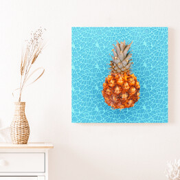 Obraz na płótnie Ananas na niebieskim wzorzystym tle