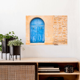 Plakat Drewniane niebieskie drzwi do domu na wyspach Morza Śródziemnego