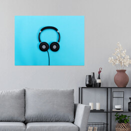 Plakat samoprzylepny Ciemne słuchawki na niebieskim tle