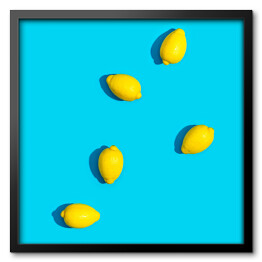 Obraz w ramie Cytryny na niebieskim tle