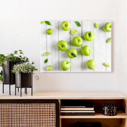 Obraz na płótnie Zielone jabłka i limonki na biurku