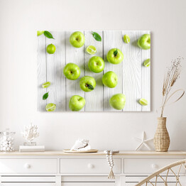 Obraz na płótnie Zielone jabłka i limonki na biurku