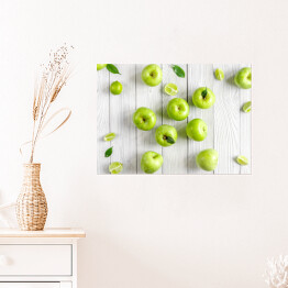 Plakat samoprzylepny Zielone jabłka i limonki na biurku