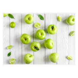Plakat samoprzylepny Zielone jabłka i limonki na biurku