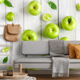 Fototapeta Zielone jabłka i limonki na biurku
