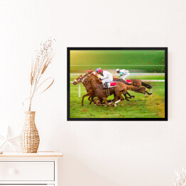 Obraz w ramie Konie wyścigowe z dżokejami na polanie
