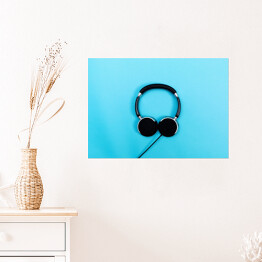 Plakat samoprzylepny Czarne słuchawki na błękitnym tle